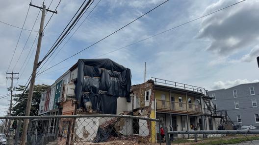 The three-story apartment complex at 501 North 8th St. in Reading remained fenced off July 18 after the south wall collapsed.