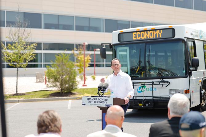 Gov. Josh Shapiro speaks in front of a bus from Lehigh Valley transit agency LANTA.