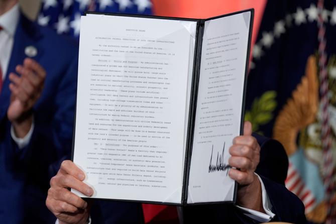 President Donald Trump holds a signed executive order on permitting for data center infrastructure. President Donald Trump holds a signed executive order on permitting for data center infrastructure.