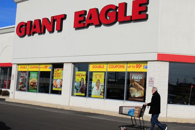A man walks out of the Giant Eagle grocery store Thursday, Nov. 17, 2011, in Mayfield Heights, Ohio.
