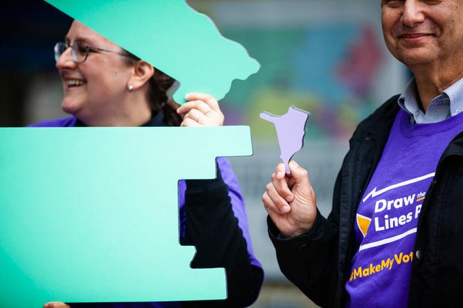 Advocates for an independent redistricting process hold a rally at the Pennsylvania Capitol in Harrisburg.