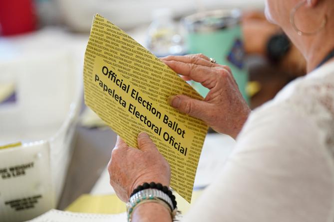 Workers sort mail ballots on primary Election Day 2024 at Northampton County Courthouse in Easton, Pennsylvania.