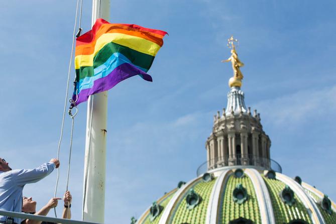 The LGBT flag flies at the Capitol building in Harrisburg.