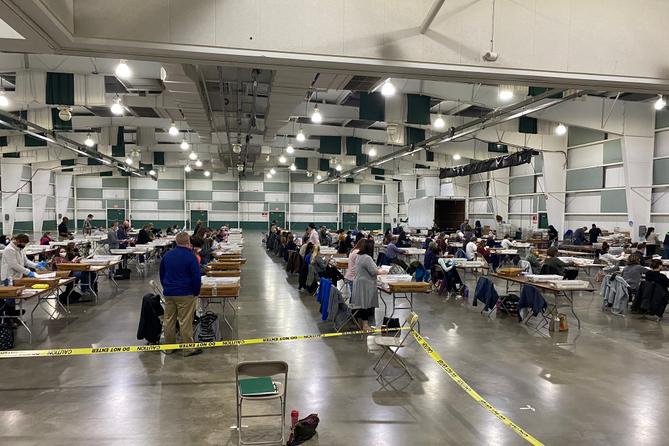 About 100 York County employees open and prepare mail ballots for counting after 8 p.m. Tuesday.