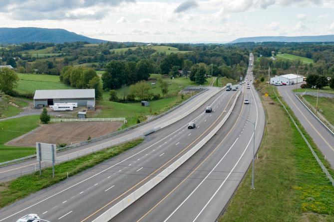 An aerial photo of U.S. Route 322 running toward State College.