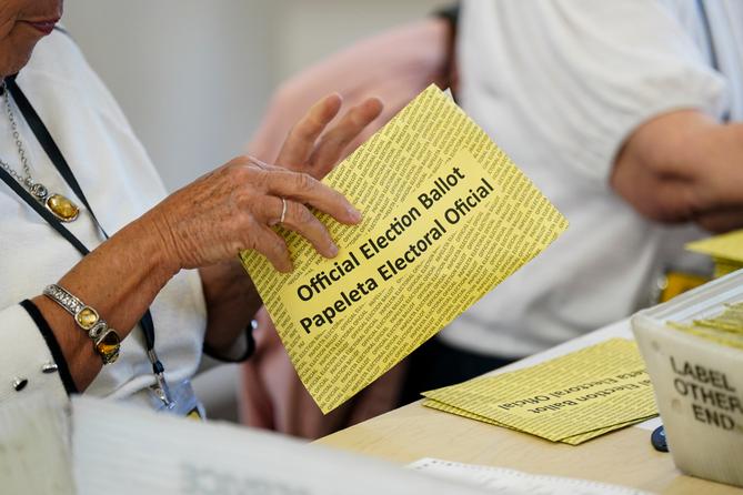 Workers sort mail ballots on primary Election Day 2024 at Northampton County Courthouse in Easton, Pennsylvania.