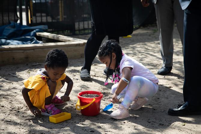 Children at Shady Lane School in Pittsburgh play in a sandbox.