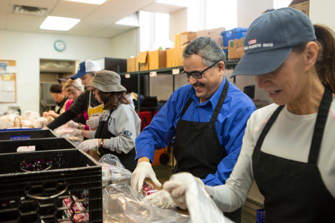 Volunteers prepare meals to deliver to older adults in Montgomery County in 2019.