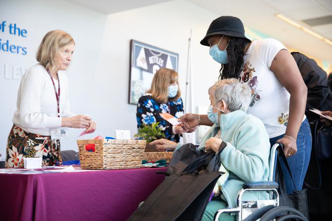 Women speak at a 2023 senior health fair in Moosic, Pennsylvania.