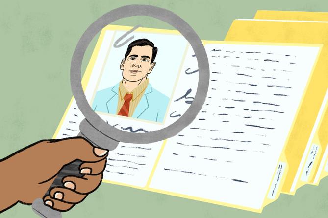 A person holds a magnifying glass up to a picture of a doctor, as part of that doctor's file.