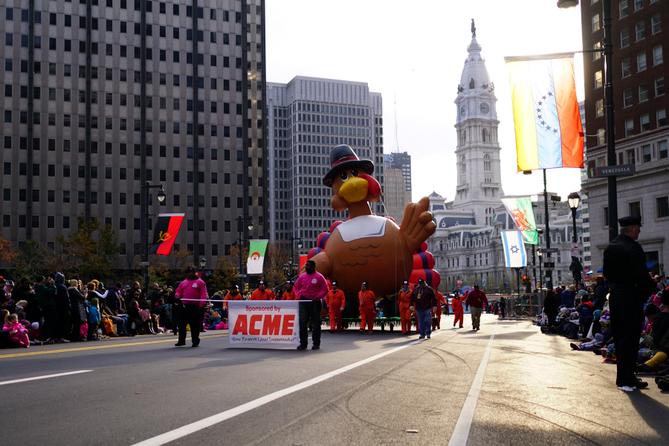 Handlers walk the turkey balloon down the Benjamin Franklin Parkway in Philadelphia during the Thanksgiving Day Parade. Handlers walk the turkey balloon down the Benjamin Franklin Parkway in Philadelphia during the Thanksgiving Day Parade.