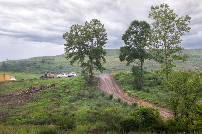 A view of the Westmoreland Sanitary Landfill in Belle Vernon, visible from a strip mall parking lot.