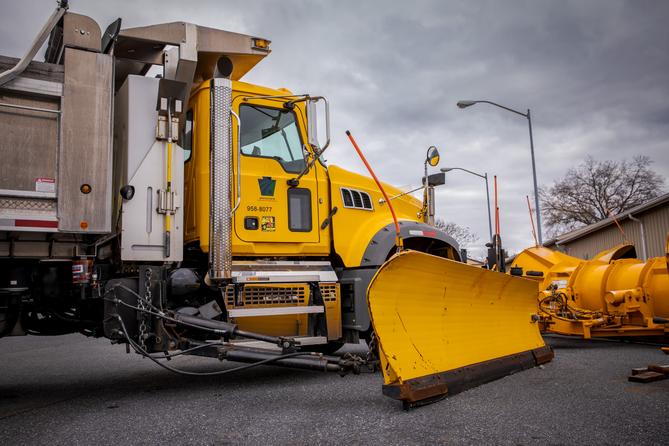 A PennDOT snow plow in a parking lot A PennDOT snow plow in a parking lot