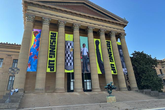 Banners for the "Rising Up: Rocky" exhibition hang outside of the Philadelphia Museum of Art in Philadelphia, Wednesday, April 22, 2026.
