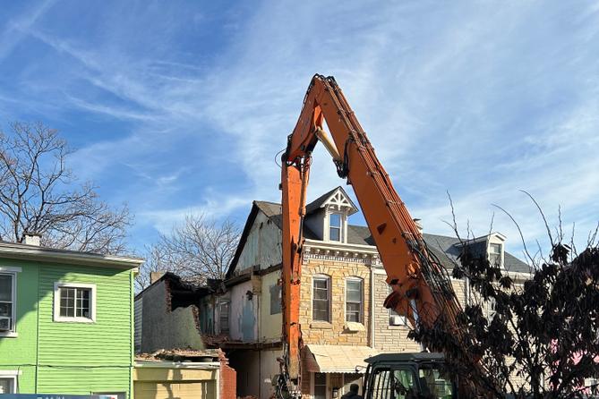 An emergency crew works to dismantle a Poplar Street home in Reading, following a partial building collapse.