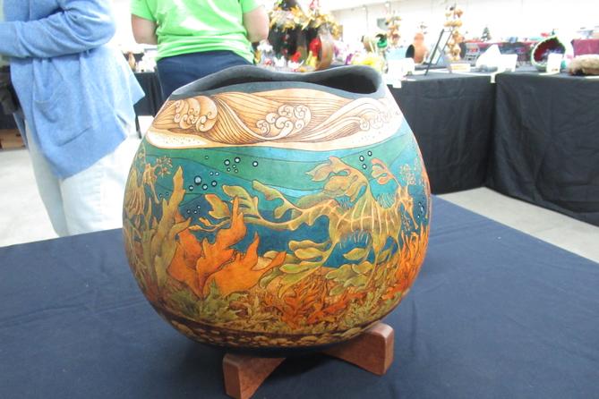 A dried gourd decorated with underwater scenery.