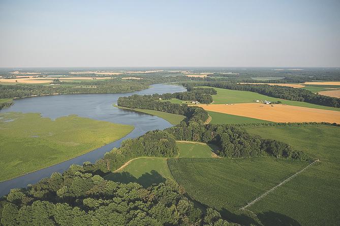Farmland and marsh are nestled together along Tuckahoe Creek in Maryland. The creek flows into the Choptank River, which in turn enters the Chesapeake Bay.