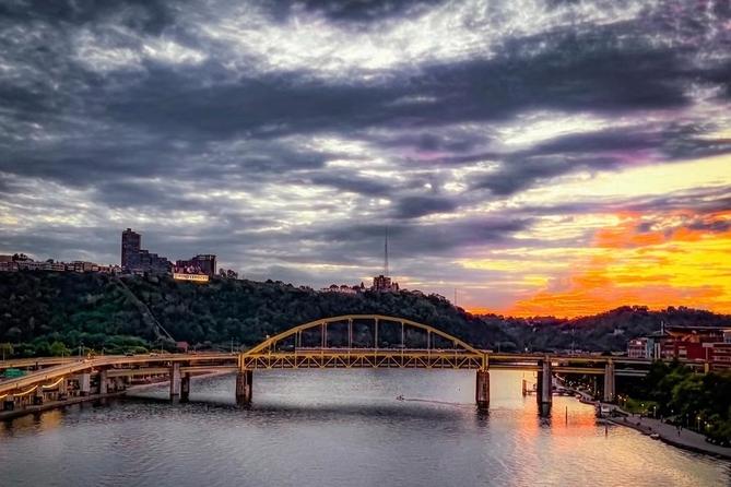 A panoramic view of a Pittsburgh bridge on a cloudy day