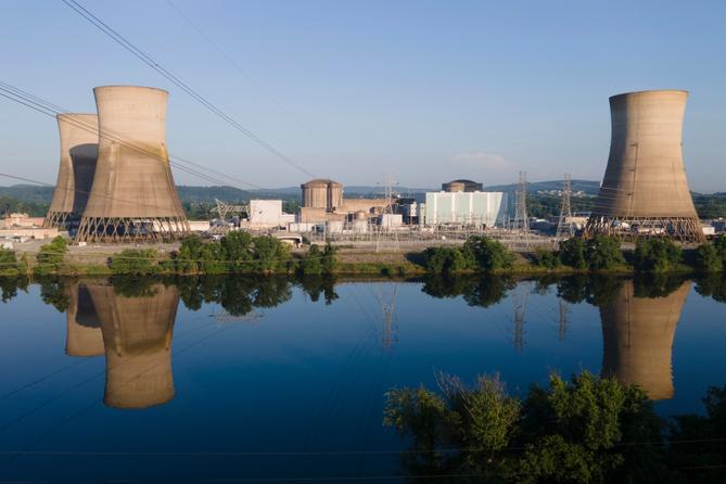 At Constellation's nuclear power plant on Three Mile Island, called the Crane Clean Energy Center, near Middletown, Pa., the cooling towers are reflected in the Susquehanna River at sunrise, June 25, 2025. At Constellation's nuclear power plant on Three Mile Island, called the Crane Clean Energy Center, near Middletown, Pa., the cooling towers are reflected in the Susquehanna River at sunrise, June 25, 2025.