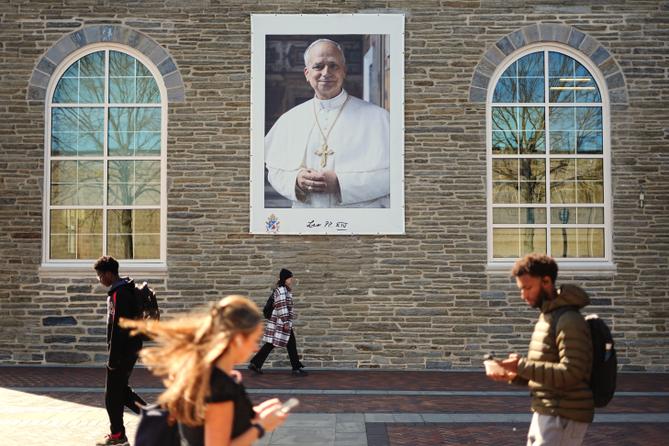 Students walk past an image of Pope Leo XIV at Villanova University in Villanova, Pa., Wednesday, Oct. 21, 2026.