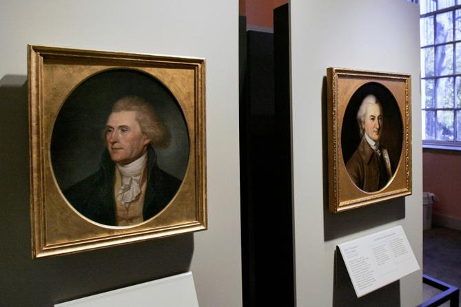 Portraits of a red-headed Thomas Jefferson, left, and John Dickinson, right, by Charles Willson Peale are seen at the refurbished Second Bank of the United States in Philadelphia.