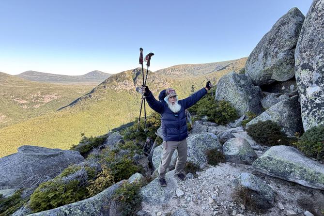Dale Sanders, 91, celebrates after completing a difficult section of Mt. Katahdin, Monday, Aug. 31, 2026, in Baxter State Park in Piscataquis County, Maine.