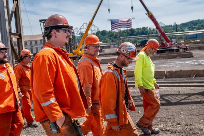 U.S. Steel employees walk to greet company and government officials at the announcement of up to $2.5 billion in investment into upgrades at the Mon Valley Works on Monday, June 8, 2026, at Edgar Thomson Plant in Braddock. U.S. Steel employees walk to greet company and government officials at the announcement of up to $2.5 billion in investment into upgrades at the Mon Valley Works on Monday, June 8, 2026, at Edgar Thomson Plant in Braddock.