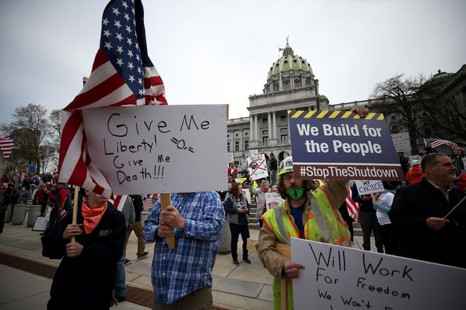 Protesters gather outside the Capitol Complex. They are calling for Gov. Tom Wolf to reopen up the state's economy during the coronavirus outbreak.