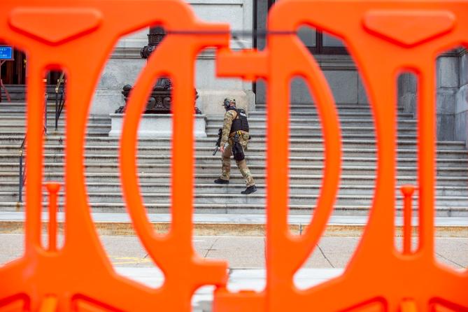 Law enforcement has erected orange fencing and deployed armed officers outside the Pennsylvania State Capitol.