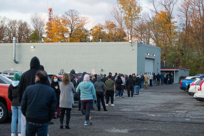 Voters stand in line at Belle Valley Fire Department in Erie County waiting to vote in person on Nov. 3, 2020.